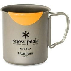 a stainless steel mug with an orange lid and the words snow peak written on it