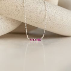 Introducing the Initial Morse Code Birthstone Necklace, a personalized piece of jewelry that blends elegance and meaning into one design ♡ The necklace features a birthstone color of your choice and can be customized with an initial or number in Morse Code, making it a unique and thoughtful gift for yourself or a loved one! Material: High Quality Solid 925 Sterling Silver Finish: Sterling Silver ∙ 18K Gold ∙ Rose Gold Dimensions: ~2.5mm Genuine CZ Round stones | ~5 x 2mm Genuine CZ Baguette ston Sterling Silver Birthstone Necklace With Gemstone Accents, Pink Gemstone Birthstone Necklace In Sterling Silver, Pink Sterling Silver Birthstone Necklace, Minimalist Gemstone Birthstone Necklace For Wedding, Pink Gemstone Birthstone Necklace For Anniversary, Minimalist Gemstone Necklace For Birthday, Sterling Silver Birthstone Necklace Fine Jewelry, Wedding Birthstone Necklace In Sterling Silver, Elegant Birthstone Necklace For Anniversary