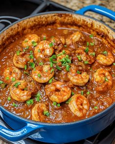 a blue pan filled with shrimp and sauce