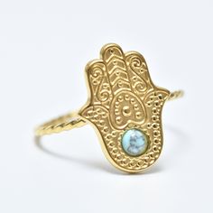 "Hamsa Ring, Blue Stone Hamsa Ring, Hamsa Ring, 18K Gold Ring, Adjustable Ring, Evil Eye Ring, Gold Filled, Stackable Ring, Gift for Her, Gift for Wife. Free international shipping Hamsa ring inlaid with  blue stone in 18K gold plating, the ring is designed in the shape of  classic hamsa. The pendant in the shape of hamsa eye is studded with special stone. Hamsa ring is  symbol of protection against the evil eye. She is  symbol of protection, good luck and spirituality. This ring is  perfect gift for anyone you want to protect. The stone embedded in the ring is  symbol of light and resurrection. It is considered  symbol of hope, happiness and protection. Add these simple yet stylish rings to your collections, bold and confident. They really go with everything!! ∙ Metal type: 18K gold plati Adjustable Gold Turquoise Gemstone Ring, Adjustable Gold Turquoise Ring For Wedding, Adjustable Gold Turquoise Ring In Spiritual Style, Adjustable Gold Spiritual Turquoise Ring, Gold Adjustable Turquoise Ring, Adjustable Gold Turquoise Ring, Adjustable Spiritual Stackable Rings As Gift, Spiritual Midi Rings As Gift, Gemstone Open Midi Rings As Gift