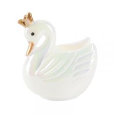 a white swan figurine with a gold crown on its head