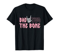 a black t - shirt with the words bad to the bone in pink letters on it