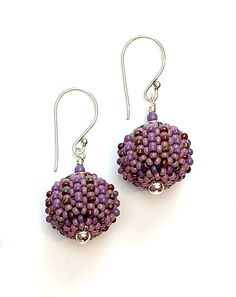 Beaded Earrings - Small glass beads in luxe orchid hues are hand woven one at a time around lightweight acrylic orbs. Sterling silver accent beads add extra polish. Comfortable sterling silver ear wires complete the look. Orb Earrings, Artful Home, Silver Accents, Ear Wires, Beaded Earrings, Hand Woven, Orchids, Glass Beads, Original Art