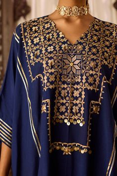 Navy blue kaftan featuring thread embroidery on the neckline highlighted with bead work and gota detailing. Paired with a gota detailed hem salwar. - Aza Fashions Bohemian Traditional Wear With Dabka Work In Blue, Traditional Drape Kaftan With Gold Embroidery For Eid, Luxury Gota Work Kaftan For Summer, Bohemian Kaftan With Gold Embroidery For Festivals, Blue Traditional Wear With Mirror Work For Festival, Traditional Drape Gold Embroidered Kaftan For Eid, Traditional V-neck Kaftan With Dabka Work, Festive Resham Embroidery Kaftan For Beach, Bohemian Kaftan For Eid With Intricate Embroidery