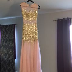 Gorgeous Pink Blush Sequined Gown. Purchased For 20% Off Because Of Flaws But Never Got Around To Fixing It Up And Wearing. New With Tags But Please See Photos Of Condition. Missing Stones Throughout Dress And Back Zipper Mesh Needs To Be Fixed As There Is A Small Hole. This Dress Is Stunning And I Hope Someone Can Put It To Great Use! Size 3/4. Brand Jovani. 100% Polyester Festive Pink Prom Gown, Gold Fitted Dress With Sheer Bodice, Gold Sheer Bodice Dress For Prom, Gold Dress With Sheer Bodice For Prom, Champagne Floor-length Dress With Sheer Bodice, Jovani Feather Dress, Coral Homecoming Dresses, Jovani Homecoming Dresses, Plunging V Neck Dress