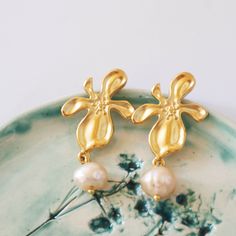 Wow picks! Orchid Baroque Pearl Earrings,Pearl Drop Earrings ,Vintage Style Earrings ,Pearl Jewelry, Anniversary Gift, mothers day gift at €34.00 Choose your wows. 🐕 #GoldEarrings #PearlDropEarrings #GiftForHer #DangleEarrings #VintageJewelry #PearlJewelry #BaroquePearl #titanium #MinimalistEarrings #PearlEarrings Handmade Flower Pearl Earrings, Handmade Flower-shaped Pearl Earrings, Elegant Cream Pearl Earrings For Gifts, Delicate Pearl Drop Earrings With Flower Shape, Delicate Pearl Drop Earrings In Flower Shape, Delicate Flower Shape Pearl Drop Earrings, Cream Pearl Drop Earrings As Gift, Handmade Gold Pearl Earrings In Flower Shape, Elegant Handmade Flower Earrings For Mother's Day