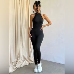 Long Jumpsuit In Lycra Polyester, With Open Back, Sleeveless, Lined, Not Transparent. Black Color Chic Black Jumpsuits And Rompers For Workout, Chic Black Workout Jumpsuits And Rompers, Sleeveless Elastane Jumpsuits And Rompers For Workout, Sleek Black Stretch Jumpsuits And Rompers, Sleek Sleeveless Stretch Jumpsuits And Rompers, Chic Stretch Jumpsuits And Rompers For Workout, Chic Black High Stretch Jumpsuits And Rompers, Stretch Athleisure Jumpsuits And Rompers For Night Out, Athleisure High Stretch Jumpsuits For Night Out