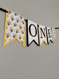 a banner that says one with bees on it