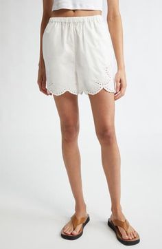 The fashion house's signature blend of minimalism and romance shines through the fresh cotton eyelet and sweetly scalloped edges of these sun-ready shorts. 3 1/2" inseam; 24" leg opening; 12" front rise; 15" back rise Elastic cuffs 100% cotton Hand wash, line dry Imported Designer Clothing This brand has B Corp certification, representing business practices with emphasis on social and environmental performance, accountability and transparency This brand meets Nordstrom Responsible Brands criteri White Bottoms With Cutwork Hem For Spring, Chic Spring Bottoms With Cutwork Hem, Chic Bottoms With Cutwork Hem For Spring, Casual Broderie Anglaise Bottoms For Spring, Spring Cotton Bottoms With Broderie Anglaise, Spring Broderie Anglaise Bottoms For Daywear, Casual Summer Bottoms With Cutwork Hem, Feminine Cotton Shorts, Casual Spring Bottoms With Cutwork Hem