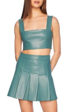 Date night is calling in this cool wide-strap tank crafted in signature faux leather with a cropped silhouette. Hidden side-zip closure Square neck Sleeveless 100% polyurethane with 100% polyester contrast Hand wash, dry flat Made in the USA of imported fabric Chic Leather Crop Top, Chic Cropped Crop Top With Zipper, Fitted Leather Crop Top, Chic Fitted Faux Leather Crop Top, Fitted Faux Leather Chic Crop Top, Fitted Cropped Faux Leather Crop Top, Spring Crop Top With Zipper Closure For Night Out, Spring Crop Top With Zipper For Night Out, Sleeveless Faux Leather Party Top