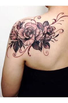 the back of a woman's shoulder with flowers on it