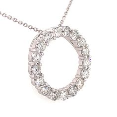 This is our magnificent Circle of Love pendant necklace in 14 kt white gold! This classic circle pendant has an amazing 7.00 ct. total weight of immaculately clean SI-1 clarity and brilliantly white F color diamonds set in a never ending circle on this pendant. A 16 inch cable link chain loops through the hidden bale of the pendant and this secures to the neck with a lobster claw closure. Anniversary Round Diamond Necklace With Prong Setting, Classic Round Diamond Necklace With Halo Design, 14k White Gold Necklace With Prong Setting, Classic White Diamond Necklace With Halo, Classic Circle Jewelry With Brilliant Cut, Anniversary Diamond Necklace With Round Prong Setting, 14k White Gold Necklace With Vvs Clarity, Round Diamond Necklace With Halo Setting For Anniversary, Anniversary White Gold Halo Diamond Necklace