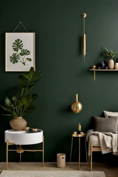 a living room with dark green walls and gold accents on the shelves, two planters and a white round coffee table