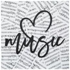 music sheet with the word music written in black and white ink on top of it