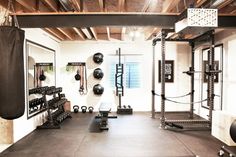 a home gym with black and white equipment