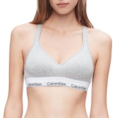 An updated Calvin Klein icon. Cut in a sports bra silhouette and crafted with a super-soft, cotton-blend construction, this women's bralette is perfect for low-impact workouts or everyday wear. An updated Calvin Klein icon. Cut in a sports bra silhouette and crafted with a super-soft, cotton-blend construction, this women's bralette is perfect for low-impact workouts or everyday wear. Padded cups Crossback straps with keyhole opening Lift construction Calvin Klein logo bandFIT & SIZING Easy Calvin Klein Medium Support Seamless Sports Bra, Calvin Klein Seamless Sports Bra With Medium Support, Cotton Athleisure Sports Bra With Built-in Bra, Seamless Cotton Sports Bra For Athleisure, Medium Support Cotton Sports Bra For Loungewear, Cotton Medium Support Sports Bra For Loungewear, Cotton Sports Bra With Medium Support For Loungewear, Casual Cotton Bra For Loungewear, Fitted Cotton Sports Bra With Light Support