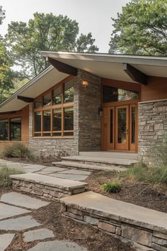 a house with stone steps leading to the front door