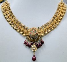 "Vintage antique 22 ct solid gold, Diamond necklace. Fully detailed handcrafted set with Diamonds ,attached genuine Ruby gemstones drops. Center Floral design deorated with multicolor enamel work. Collection piece in very good condition. Total length-40 cm(16\") we can adjust length, Width including dangles-6 cm(2.36\"), total weight-26 grams(0.91 ounces), material-22 ct solid gold , Diamonds , enamel , Rubies." Indian Bridal Choker, Bridal Choker Set, Temple Necklace, Large Bead Necklace, Work Necklaces, White Gold Pendant Necklace, Necklace Set Indian, Bridal Choker, Bangles Jewelry Designs