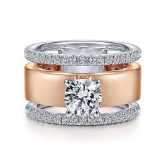 two tone gold and silver wedding ring set with an oval cut diamond in the center