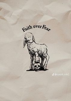 a paper bag with a drawing of a sheep and the words faith over fear on it