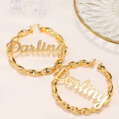 Name Twist Earrings, Custom Hoop Earrings, Personalized Earrings, Name Earrings, Large Big Hoop Earrings, Personalized Nameplate Jewelry . . . . . . . . . . . . . . . . . . . . . . . . . . . . . . . . .  * Product Description ♡ :  Introducing our captivating Name Twist Earrings, a pair of custom hoop earrings that beautifully combine personalized style with a unique twist design. These earrings are the perfect choice for those seeking a bold and personalized accessory that stands out from the cr Elegant Personalized Hoop Earrings For Party, Trendy Hoop Earrings For Wedding, Trendy Wedding Hoop Earrings, Earrings Name, Meaningful Gifts For Her, Twist Earrings, Twist Pattern, Name Earrings, Big Hoop Earrings