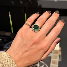 Estate/ vintage 18KT yellow gold, sugar loaf shape cut, blue tourmaline, bezel-set + halo diamond ring. Size 6 Can be resized by us for a fee, or your local jeweler Ring weight: 13.00 grams 12.35 carat, center, sugar loaf cut blue tourmaline, cabochon, bezel set in yellow gold. Center stone measures approx.: 13mm x 13mm Prong set, pave, halo’d, and 2 bezel set diamonds on either side if halo. 1.00 carat genuine diamonds; VS clarity; G-H color Rounds and Baguettes diamonds on side band Stamped an Elegant Emerald Cut Tourmaline Jewelry, Luxury Tourmaline Jewelry With Halo Setting, Emerald Cut Tourmaline Jewelry With Accent Stones, Fine Jewelry With Princess Cut Bezel Setting, Fine Jewelry With Bezel Setting Princess Cut, Princess Cut Jewelry With Bezel Setting In Fine Style, Green Tourmaline Jewelry With Halo Setting, Cushion Cut Heirloom Gemstone Jewelry, Luxury Tourmaline Jewelry With Rose Cut Diamonds