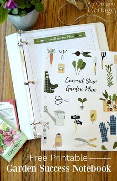 an open garden planner sitting on top of a wooden table