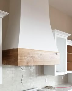 a stove top oven sitting inside of a kitchen