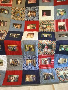 a quilt with pictures on it is laying on the bed and has been made into a blanket