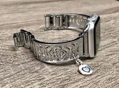 Know Someone Who Owns a Apple Watch? This is the PERFECT gift! High Quality Premium Shiny Silver Color Band for Apple Watch All Series Comfortable Bangle with Secure Clasp Lock, Includes Extra Links and Pins Tool to Resize Wristband To Preferred Fitment Adjustable Size Fits 5.5 to 8 Inches (need to add or remove extra links) Super Light Bracelet - Weighs Around 1.2 oz 18mm Wide, Designed And Handmade by Simeon D Jewelry Not For Other Models. Tracker Is NOT Included Follow my Studio for Updates & Adjustable Stainless Steel Apple Watch Band For Gift, Silver Rectangular Watch Accessories For Gifts, Adjustable Stainless Steel Apple Watch Band Gift, Silver Rectangular Watch Accessories As Gift, Rectangular Silver Watch Accessories For Gifts, Rectangular Stainless Steel Watch Band As Gift, Rectangular Stainless Steel Watch Bands As Gift, Adjustable Silver Watch Bands As Gift, Silver Stainless Steel Apple Watch Band As Gift