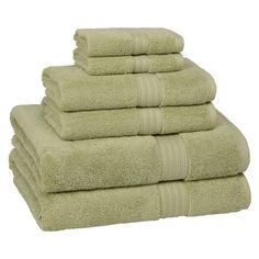 six towels stacked on top of each other in light green color, with one folded