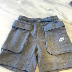 Nike Shorts. Boys Medium Large Pockets. School Cotton Shorts With Pockets, Cotton School Shorts With Pockets, Casual Gray Bottoms For School, Nike Athletic Shorts With Pockets For Streetwear, Nike Cotton Shorts With Side Pockets, Nike Casual Shorts With Side Pockets, Nike Streetwear Shorts With Pockets, Sporty Bottoms With Pockets For Playwear, Sporty Playwear Bottoms With Pockets