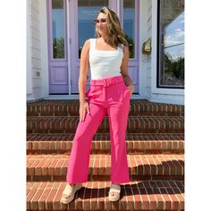 High rise belted trousers features side pockets and a flared leg. Absolutely flattering and stretchy in all the right places. Runs True to size model is wearing size small. 100% polyester