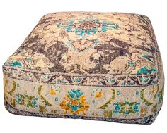 a multicolored square ottoman with an ornate pattern on it's sides and bottom