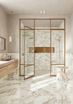 a bathroom with marble floors and walls