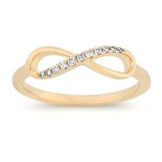 A forever stunning design to represent your forever love is this gorgeous infinity ring crafted of quality 14 karat yellow gold. Eleven round natural diamonds  at approximately .07 carat total weight  have each been hand-selected for exceptional brilliance and are pave-set across the infinity design. The ring measures 1.5mm at the band. Diamond Infinity Ring, Infinity Diamond Ring, Infinity Design, Platinum Jewelry, Infinity Ring, Ring Crafts, Filigree Design, The Infinity, Bling Rings