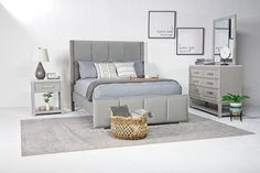 a bed room with a neatly made bed and two nightstands