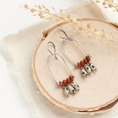 The perfect blend of modern elements and rustic touches. Warm red jasper and playful dalmatian jasper are pinned on handmade silver arches. This is one of my favorite new styles this season! Handmade Shepherd hook earwires. Measure about 2”. Sterling silver, which has been oxidized and hand polished for an antique finish. About Jasper: The name jasper comes from the Greek meaning "spotted stone". It can be spotted or striped depending on the foreign minerals included. Jasper is a microcrystalline variety of Quartz. It comes in many different colors and is found all over the world. Jasper is an important stone to the spiritual practices of the Native Americans. Jasper is one of the most protective gemstones. It is a stone of gentleness and relaxation. It helps ground and balance one's body Luxury Handmade Southwestern Jewelry, Luxury Jasper Jewelry For Gift, Protective Gemstones, Moab Arches, Greek Meaning, Arch Earrings, Earring Pins, Shepherds Hook, Dalmatian Jasper