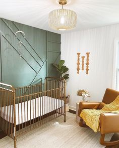 a baby's room with a crib, rocking chair and large potted plant