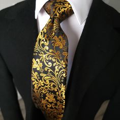 Black Gold Floral Silk Tie Pocket Square Cufflink Set - STYLETIE Black Suit Gold Accent, Elegant Black Tie Pocket Square, Elegant Pocket Square For Black-tie Events, Elegant Ties For Black-tie Events, Elegant Ties With Pocket Square For Black-tie Events, Elegant Black Suit And Tie Accessories With Pocket Square, Gold Suit And Tie Accessories For Business, Luxury Gold Suit And Tie Accessories For Formal Occasion, Black Wedding Tie With Pocket Square