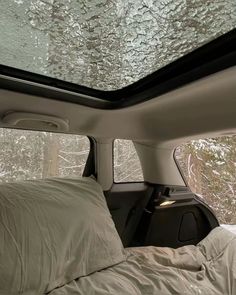 the inside of a car with snow on the roof