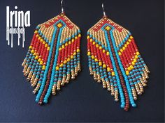 two pairs of beaded earrings with fringes and beads hanging from the ends of them