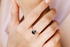 Black onyx 14K gold ring. A dainty, delicate black onyx gemstone ring, ideal for stacking for every woman who loves elegance. An excellent choice for anniversary gift or birthday gift for her. 100% handcrafted with love!D E T A I L S● Metal: 14K solid gold, 14K white gold or 14K rose gold● Gemstone: Black Onyx, briolette cut● Stone Diameter: 8mm (0.31in), 10mm (0.4in) and 12mm (0.5in) R I N G ∙ S I Z I N GFor General Reference:● we use standard US Ring Sizing● an average women's ring finger is s Minimalist Black Jewelry For Anniversary, Timeless Black Jewelry With Bezel Setting, Elegant Round Onyx Rings, Minimalist Black Spinel Ring, Modern Black Spinel Rings For Gift, Modern Black Spinel Rings For Gifts, Modern Black Spinel Rings As Gift, Elegant Adjustable Faceted Rings, Dainty Black Ring Jewelry