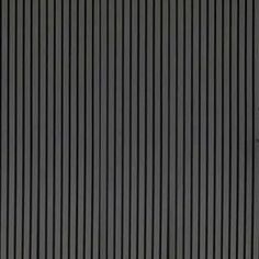 a black wall with vertical lines on it