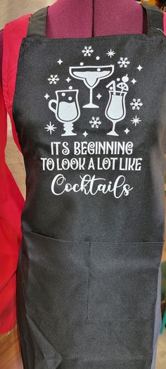 an apron that says it is beginning to look a lot like cocktail