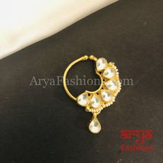 Kundan CZ non piercing nose ring Nosepin/Bridal nosering/Indian Wedding Jewelry/Bridal NoseClip/ Nose Ring/Indian Nath Faux Nose Ring,Bollywood Nose Ring, Traditional Nath, Sabyasachi Indian nose pinAvailable in pretty colorsFeaturesTraditional Handwork Kundan Nose pinHandcrafted To Perfection,Light Weight Nose PinHandmade JewelryLength: 1 InchesClip Feature Nose PinPerfect for any Indian Wedding and Bridal attireMade in Brass with very high quality Kundan and CZ stones Gold Kundan Nose Ring In Temple Jewelry Style, Gold Kundan Nose Rings Temple Jewelry, Festive Chandbali Nose Ring For Weddings, Elegant Chandbali Nose Rings For Wedding, Wedding Chandbali Nose Ring, Gold Nose Studs For Wedding, Elegant Round Nose Studs For Wedding, Elegant Wedding Nose Studs, Elegant Round Wedding Nose Studs