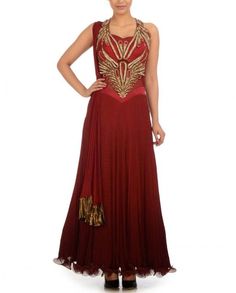 This shaded maroon color frock suit is in chiffon fabric having zari embroidery on neck. Backside of this frock suit is designed in beautiful flairs which enhance look of this frock suit. Dupatta of this frock suit is also in chiffon having golden color borders. Designer Sleeveless Dresses With Dori Work, Sleeveless Dresses With Dori Work, Sleeveless Anarkali Dress With Dori Work, Elegant Sleeveless Georgette Anarkali Set, Red Traditional Drape Party Dress, Red Party Dress With Traditional Drape, Elegant Red Anarkali Set With Dori Work, Designer Sleeveless Anarkali Party Set, Sleeveless Party Dress With Dupatta