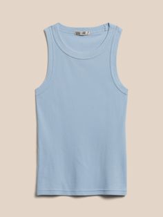 Ultra-soft, ultra-stretchy, this form-fitting tank is made with our micro-ribbed cotton jersey that has been specially washed for an luxurious feel against the skin.  High crew neck.  Sleeveless.  Straight hem.  Produced in a facility that runs P. A. Fitted Basic Muscle Tank Tee, Fitted Basic Muscle Tee, Seamless Crew Neck Cotton Tank Top, Basic Fitted Muscle Tank Tee, Cotton Sleeveless Tank Top With Ribbing, Seamless Cotton Crew Neck Tank Top, Fitted Basic Tank Muscle Tee, Basic Seamless Crew Neck Tank Top, Casual Ribbed Tank Top With Minimal Stretch