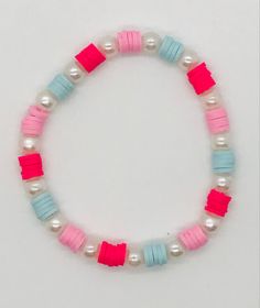 a bracelet with pink, blue and white beads