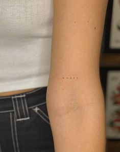 a woman with a small tattoo on her arm